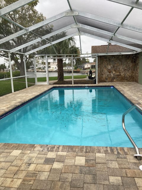 pool with a view inside a screened lanai