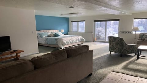 Living area with a view to the bedroom area to the right.