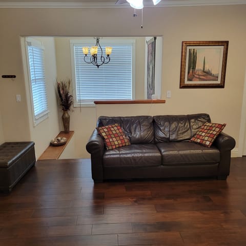 Upstairs Living Area with Full Size Leather  Couch.