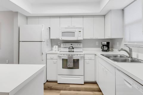 The kitchen comes with all the pots, pans, dishes, glasses, and silverware needed to cook and serve simple meals while on vacation.