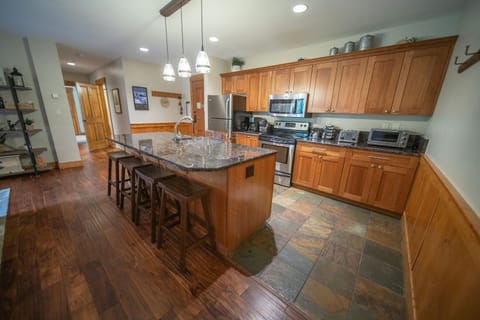 Modern kitchen with bar stool seating at island