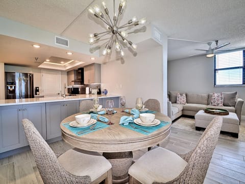 Dining table has seating for 4 guests.