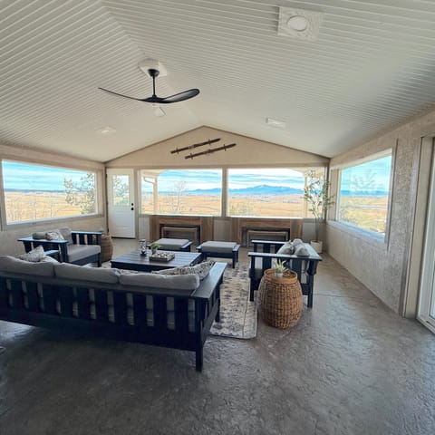 Cozy sunroom with sweeping views of Pikes Peak.