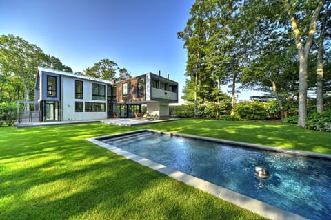 Stylishly modern, comfortably chic and very private. This home is transporting