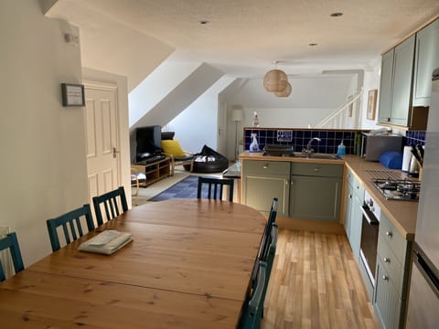 Kitchen/Dining Area, when cooking still join in & with seating for 10 persons!