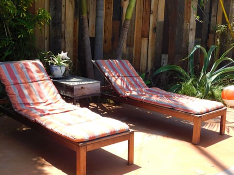 reclining teak loungers