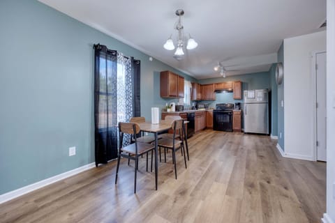 The kitchen with a table and four chairs