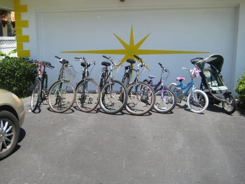 Bikes and strollers in front of 2-car garage.