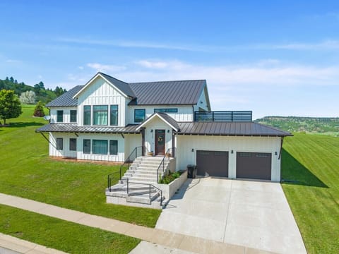 Custom built home with beautiful views, rooftop deck, steam shower, hot tub, arcades, and more!