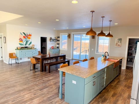 Plenty of seating at both the large island and dining table for everyone in the group to be together.