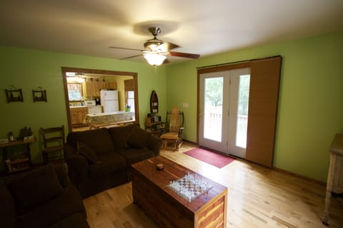 French doors to the deck and view of the river and trail.