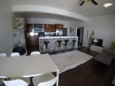 Mahagony kitchen with fridge, freezer, stove, oven. Granite countertops.