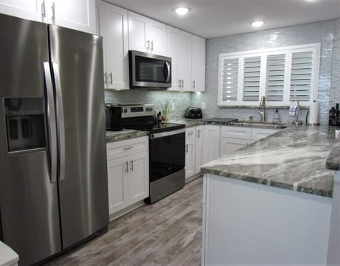 Brand new and Fully equip Kitchen - Cook up your favorite meals in the brand new and fully equip kitchen!