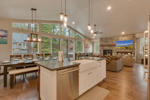 - Dining area for large groups  
- Open kitchen and forest views  
- Family-friendly cabin near Tahoe