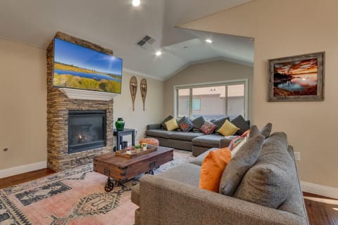 - Cozy living room with stone fireplace and smart TV  
- Spacious sofas with colorful pillows for family comfort  
- Perfect Airbnb stay for relaxation near Lake Tahoe