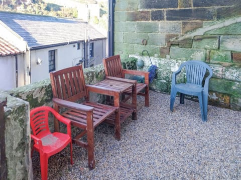 External yard with seating overlooking the beck | Flither Cottage, Staithes, near Saltburn-by-the-Sea