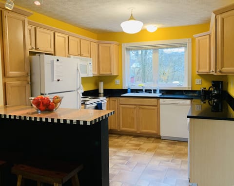 Full stocked kitchen, locally roasted coffee, under counter washer and dryer.