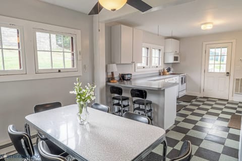 Dining table sits 6, and the bar seating offers two additional