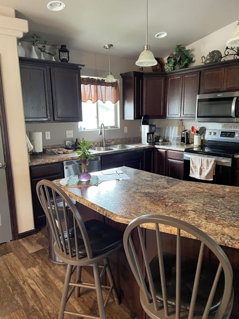 Kitchen, complete with fridge, microwave, oven, dishwasher and coffee maker