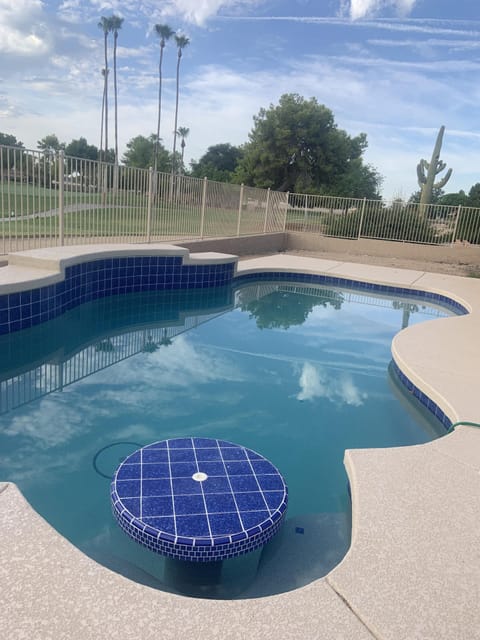 Pool with table seating and Baha slanted shelf at entry