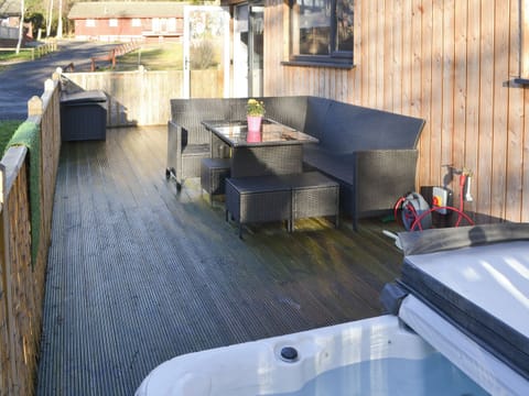 Outdoor area with hot tub | The Hideaway, Otterburn, near Bellingham
