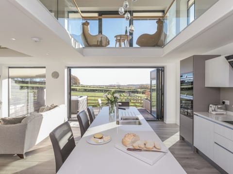 Open-plan living area with bi-fold doors to patio area | The Lookout - Broadstone Barns, Ticknall, near Derby