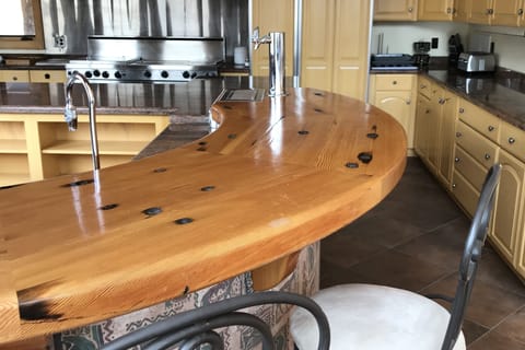 Gourmet kitchen with coffee machines, large commercial grade oven/stove etc