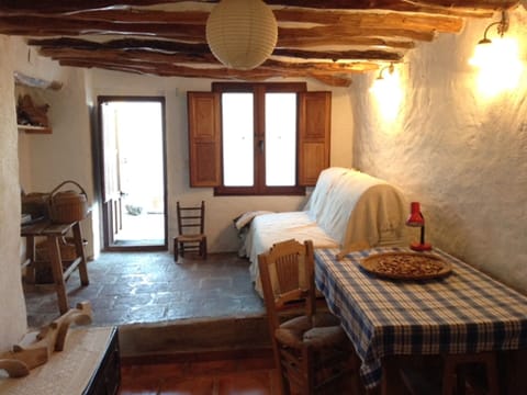 Living room with sofa bed,  dining area, door to terrace,
