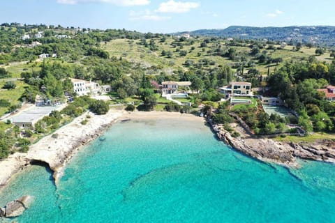 Serene villa retreat with stunning turquoise waters just steps from the beach.