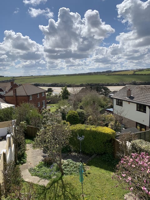 Private rear garden with decked area and glimpses of the River gannel