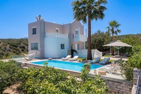 Beautiful villa facade overlooking scenic surroundings.