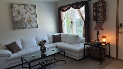 Living room with white leather sectional