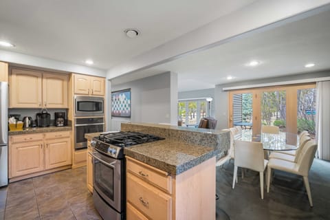 Your spacious kitchen flows seamlessly into the dining area, perfect for preparing meals and gathering with loved ones in comfort.