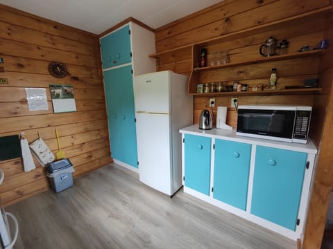 Fully equipped kitchen, with full stove and large fridge with freezer space.