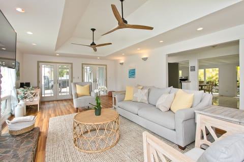 Open living room with TV, DVD, stereo, phone and wifi.