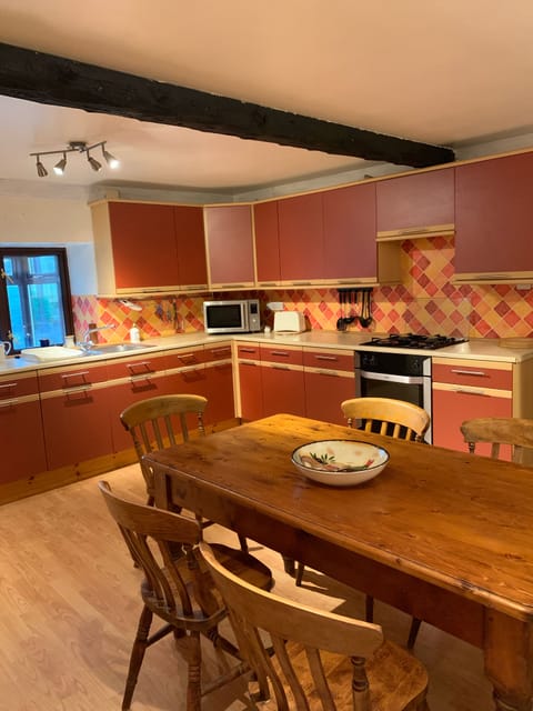 Large kitchen with dinning table and chairs