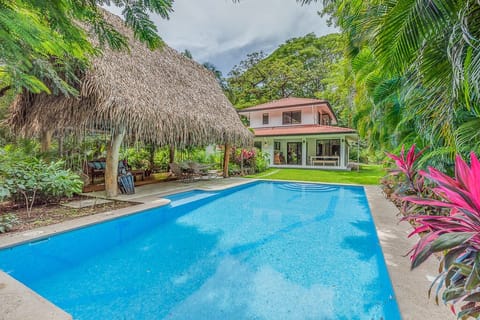 Large private pool and rancho with lush landscape