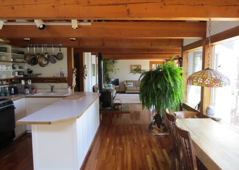 Kitchen, dining table, livingroom in the background.