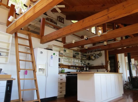 Ladder up to loft. Loft runs the length of the house.