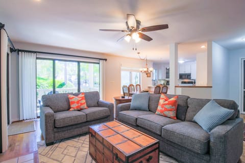 There are two sets of sliding glass doors in the living room -- one to the screened porch and one to the deck.