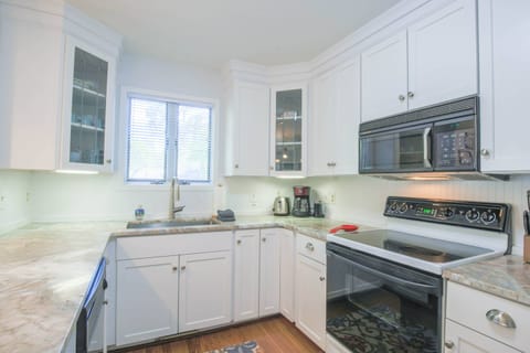 The kitchen has been renovated with new counters, cabinets, sink & faucet.