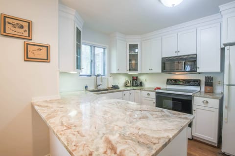 The kitchen is well furnished with cookware, dinnerware, glassware & cutlery.