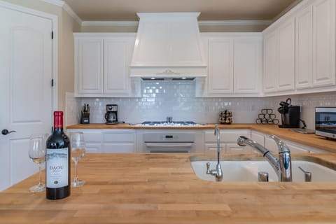 Enjoy a glass of wine while prepping a gourmet meal.