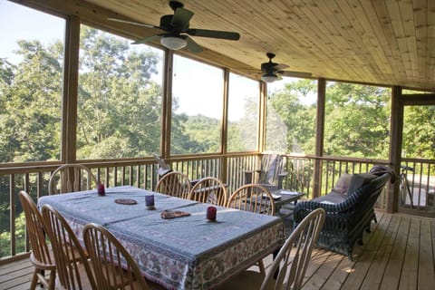 Screen porch cantilevered out over the valley