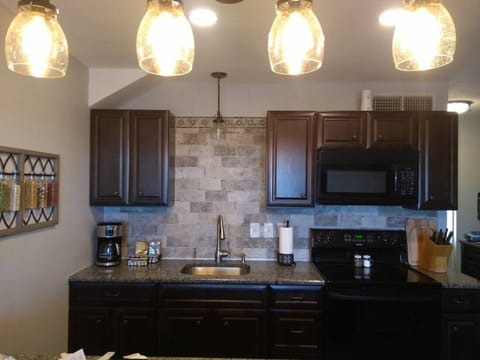 Coffeemaker, coffee, creamer and sugar available to start your day off right.