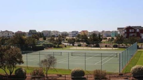 view of tennis courts, playgrounds, and basketball from upper deck