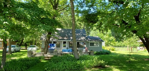Large shaded yard, great for yard games.  Swingset and rope swing, private drive