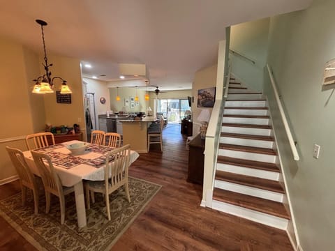 Dining area, kitchen, and living room.