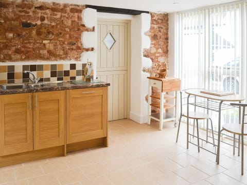 Kitchen with modest dining area | Fair Maid - Glimsters Farm Holiday let, Kentisbeare, Cullompton