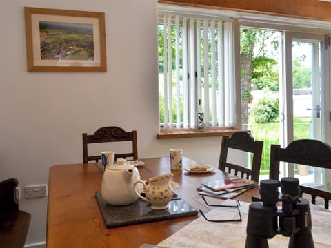 Patio doors leading to courtyard | Fair Maid - Glimsters Farm Holiday let, Kentisbeare, Cullompton